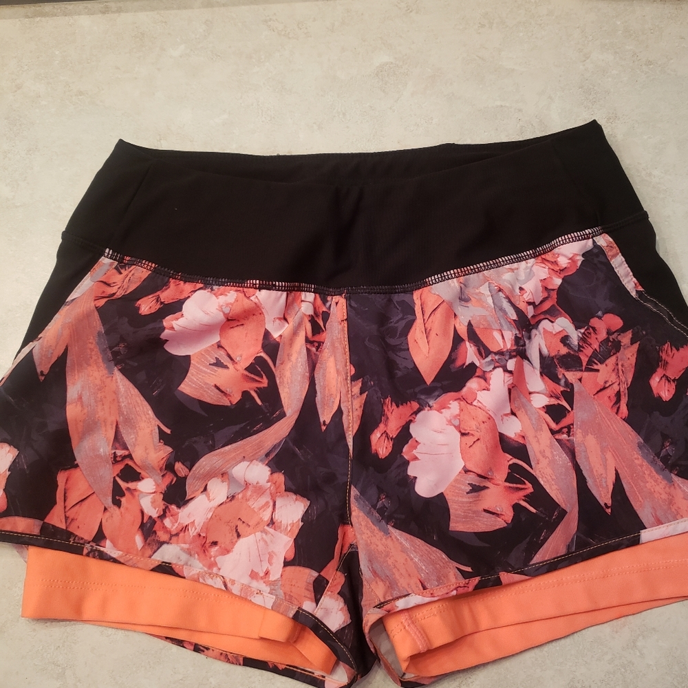 Like new, black and coral work out shorts. Biker shorts under jogging shorts.